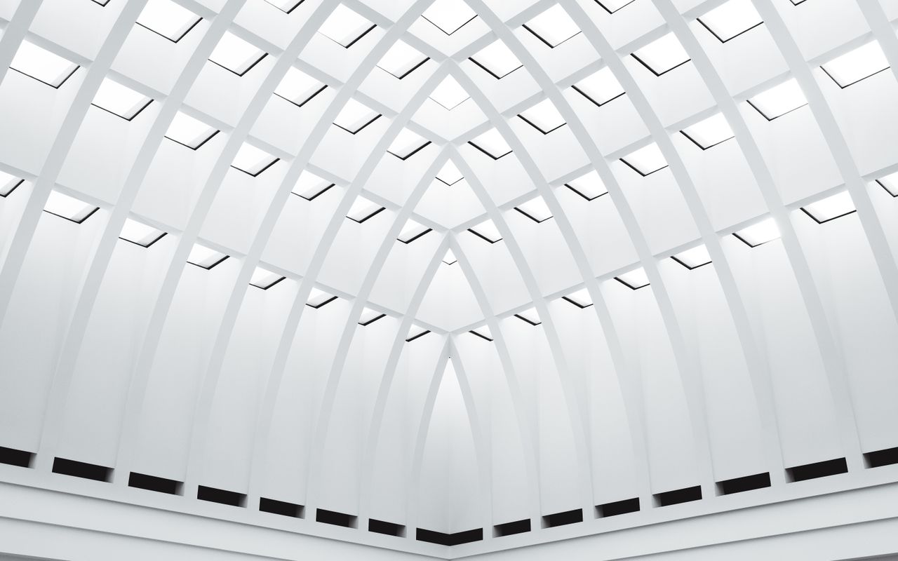 A striking view of modern symmetrical architecture in Berlin, showcasing structural elegance in monochrome.