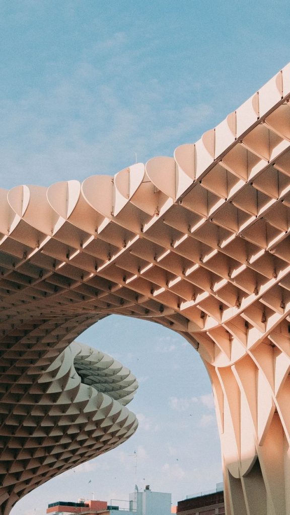 Stunning view of the Metropol Parasol's innovative design against a clear blue sky in Seville, Spain.