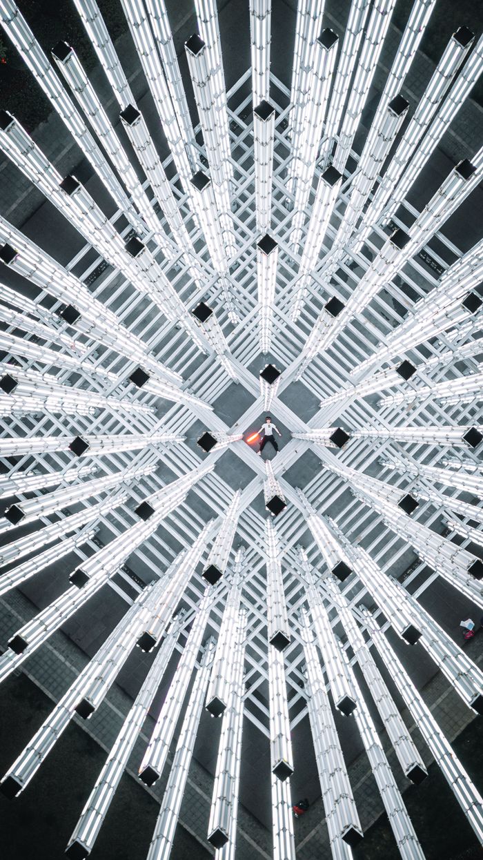 A captivating view of a modern lighting installation from above, capturing the futuristic design of Shanghai's urban architecture.